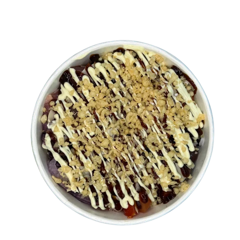 Poke bowl on black rice with creamy sauce and crushed nuts